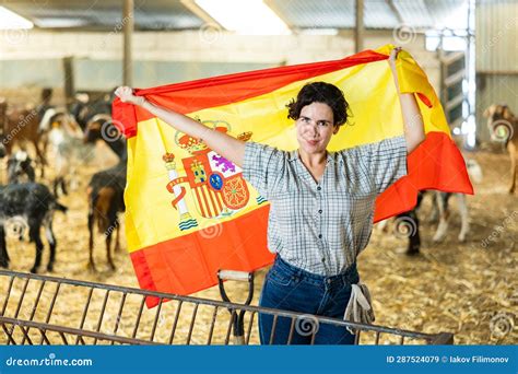 Happy Female Farmer Standing In Goat Shed With Spanish Flag Stock Image Image Of Nationalism