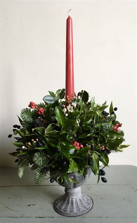 Rustic Urn Arrangement A Mix Of Seasonal Foliage Berries And Wax