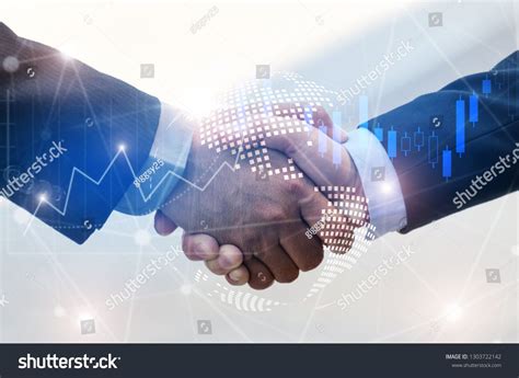 Business Man Handshake With Effect Chart Of Stock Forex Market And