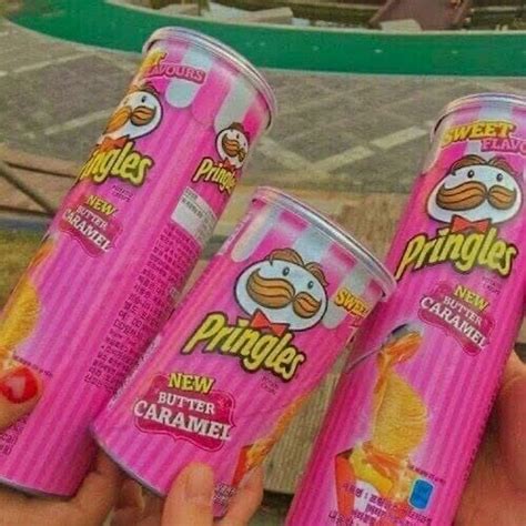 Three Cans Of Pringles Next To Each Other