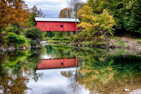 Early Fall Colors Surround A Covered Bridge In Vermont