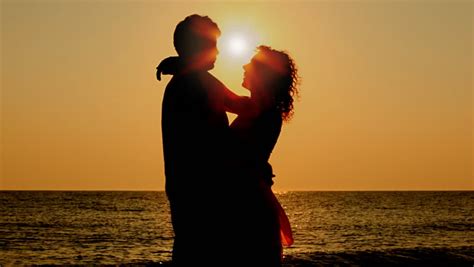 Sad boy with bowed head on the background of the sea at sunset. Woman Hugs Her Dog At Sunset Stock Footage Video 6471647 ...