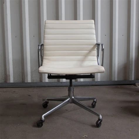 Ergonomic office chairs 1 item. 1958 Ray and Charles Eames, White Vinyl Adjust, Tilt, Office Chair Four Wheels For Sale at 1stdibs