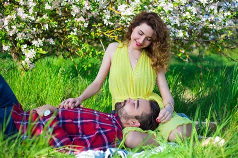 Lovely Beautiful Couple Sitting In Blooming Garden Stock Image Image