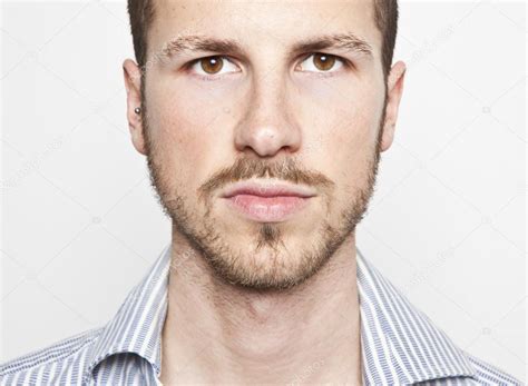 Young Mans Face Serious Expression — Stock Photo © Tommasolizzul