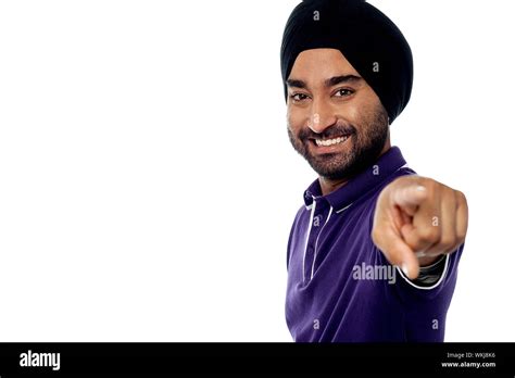 Smiling Young Indian Guy Pointing Cut Out Stock Images And Pictures Alamy