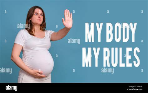 Text My Body My Rules And Pregnant Woman Raised Her Hands In The Air In A Sign Of Refusal And