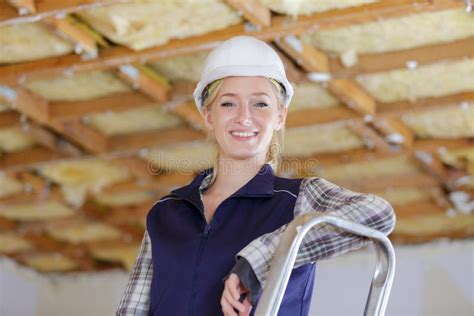 Portrait Female Builder On Stepladder In Property Stock Image Image