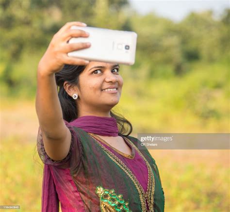 Happy Young Indian Girl Taking A Selfie On Smartphone At Outdoor High
