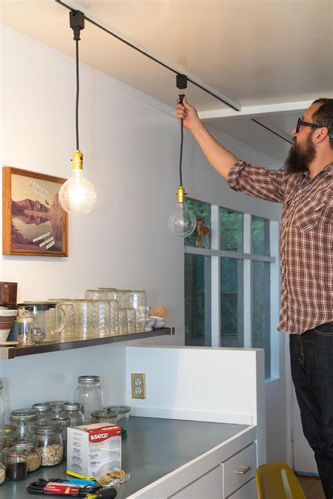 Kitchen track lighting is no longer stuck in the dark ages. DIY Kitchen Track Lighting Solution | Apartment Therapy