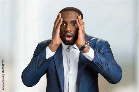 Shocked Afro American Businessman Black Man Hold Hands On Head And Open Mouth With Astonishment