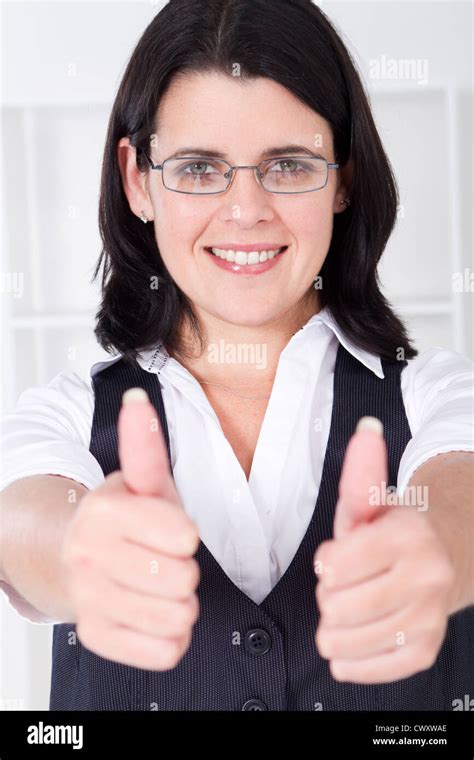 Portrait Of A Friendly Businesswoman Giving Thumbs Up Stock Photo Alamy