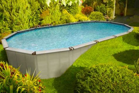 A sloping back yard is leveled out for a new pool and outdoor entertaining space. Semi inground pool ~ this would work in our uneven ...