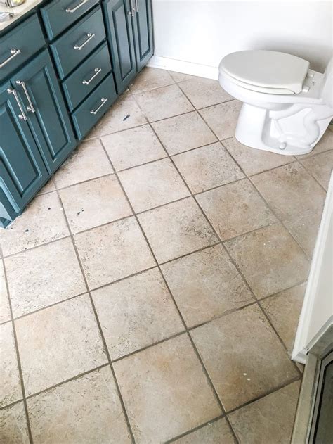 Ensure the nail head sits properly. How to Install Sheet Vinyl Flooring Over Tile - Bless'er House