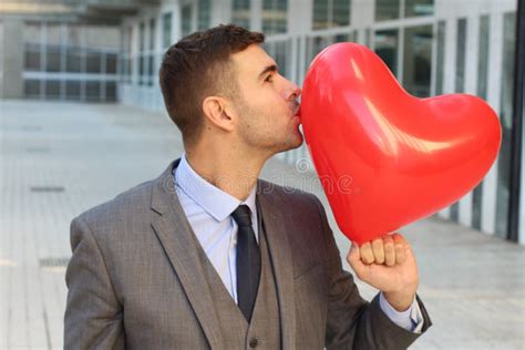 Businessman Kissing A Giant Heart Stock Image Image Of Balloon