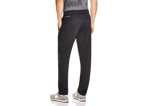 Under Armour Woven Tapered Pants In Black For Men Lyst