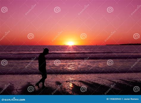 Man Walking At Sunset Beach Stock Image Image Of Beautiful Light