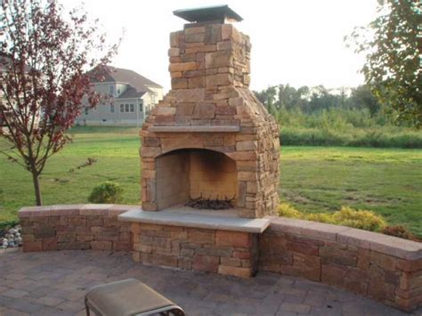 Outdoor Fireplace With Custom Brick Design Elements In New