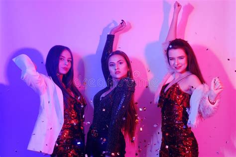 Three Beautiful Girls Are Dancing In Neon An Incredibly Fun Party With Girls In Shiny Dresses