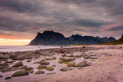 Dramatic Midnight Sunset With Amazing Colors Over Uttakleiv Beach On