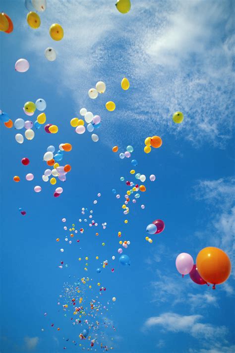 Hawaii Colorful Balloons Float In The Air Against A Blue Sky With