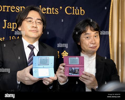 Satoru Iwata L President Of Nintendo Co Ltd And Shigeru Miyamoto R Senior Managing
