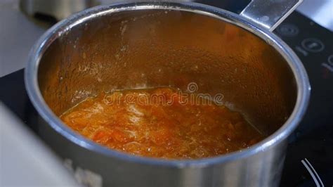 Tpumpkin Boiling In A Pot On The Stove Pumpkin Syrup Is Boiling In A
