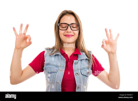 Young Calm Woman Smiling Happily While Meditating With Hands Up Showing Ok Gesture Isolated On