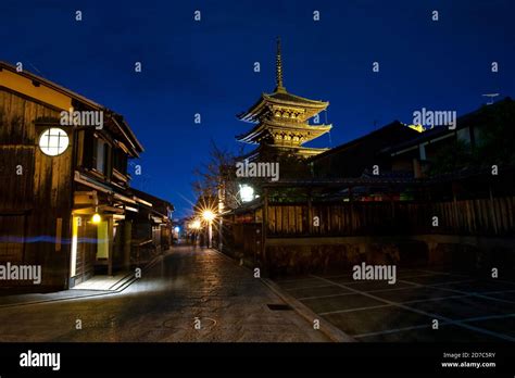 Cityscape In A Small Street In Kyoto You Can See Yasaka Shrine At Dusk