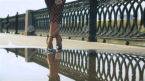female legs in high heels shoes walking in the puddle stock image image of pavement movement