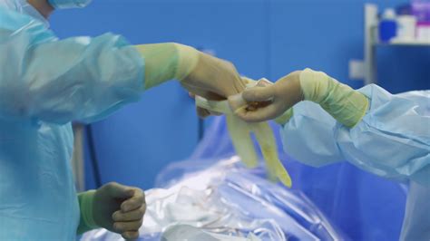 A Doctor With A Surgical Mask And Latex Gloves Stock Photo