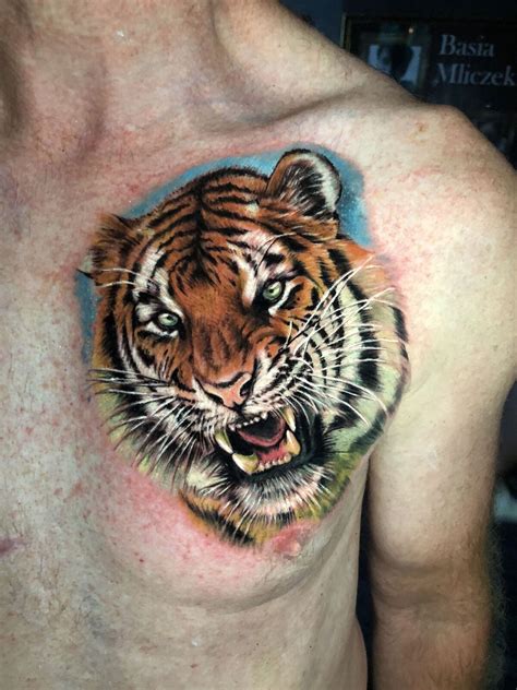 A Man S Chest With A Tiger Tattoo On His Chest And The Face Of A Tiger