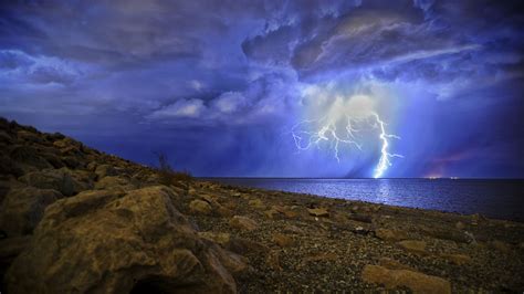 Download Wallpaper 2560x1440 Lightning Storm Lake Overcast Shore
