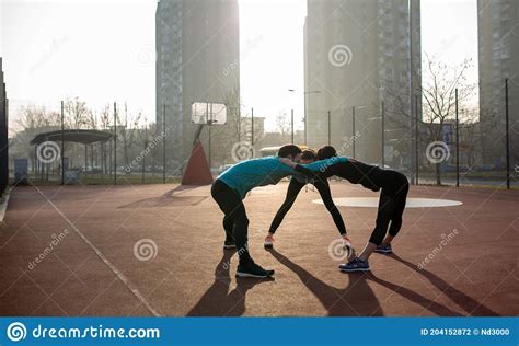 Group Of Sports Friends People Are Training Outdoors Stock Photo