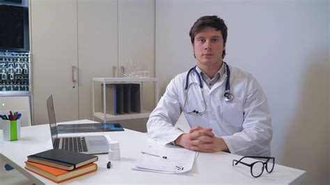 Caucasian Kindly Doctor Asking Question Writing Prescription And Give