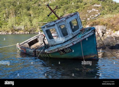 A Derelict Old Fishing Boat Abandoned On A Loch On The Isle Of Skye