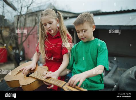 Children Learn To Play The Guitar Stock Photo Alamy