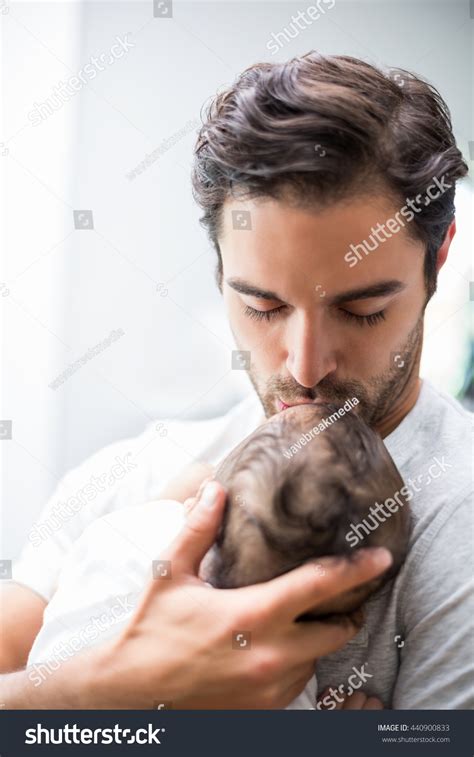 Closeup Father Kissing Baby While Standing Stock Photo 440900833