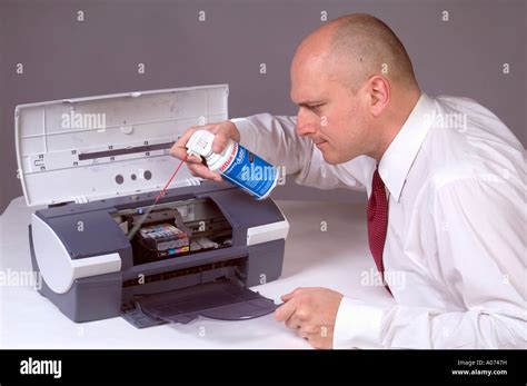 Man Cleaning Computer Printer With Compressed Air 4 Stock Photo Alamy