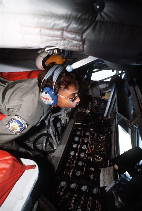 An Aerial Refueling Boom Operator Looks Out The Observation Window Of A