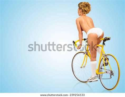 Retro Photo Of A Nude Sexy Pin Up Girl In White Panties Riding A Yellow