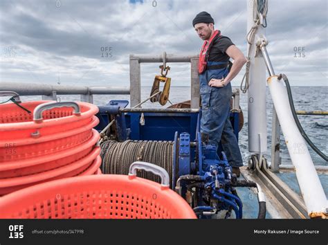 Fisherman With Winch On Trawler Research Ship Stock Photo Offset