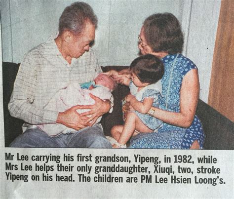 mr lee kuan yew carrying and admiring his 1st grandson lee yipeng with mrs lee and granddaughter