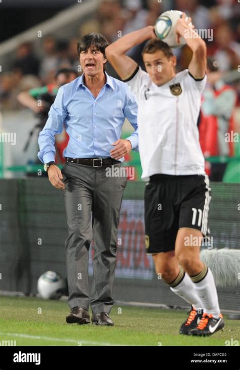 german national coach joachim loew l shouts directions to miroslav klose during the friendly