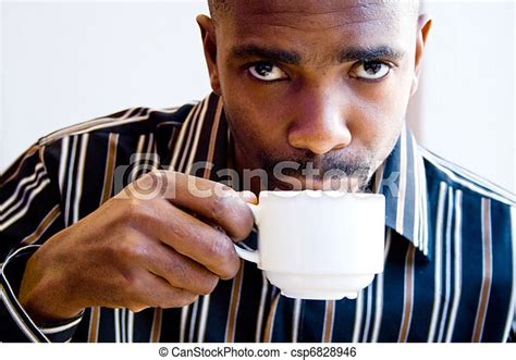 African Man Drinking Coffee Canstock