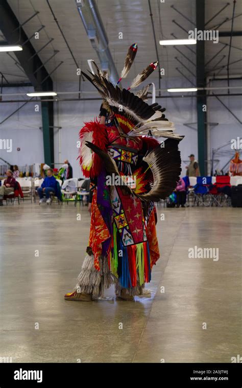 Native American Dancer Dressed In Full Regalia At A Pow Wow Where