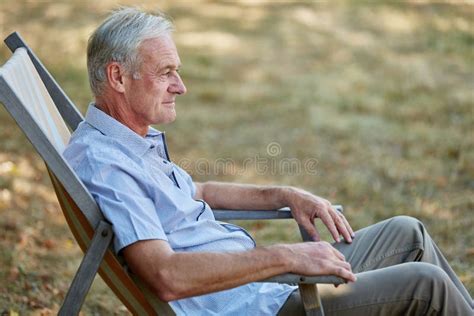 Old Man Sitting Relaxed On A Deck Chair Stock Image Image Of Outdoors