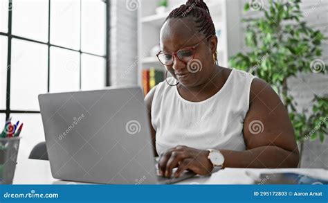 Focused African American Woman Worker Excelling in Business. Working