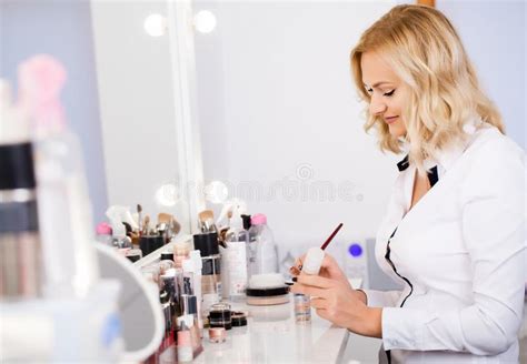 Makeup Artist At His Workplace In The Mirror Preparing Tools To Get