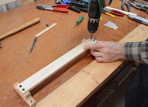 Transfer the handle width to the pipe and mark out the slot. Making wall tool holders